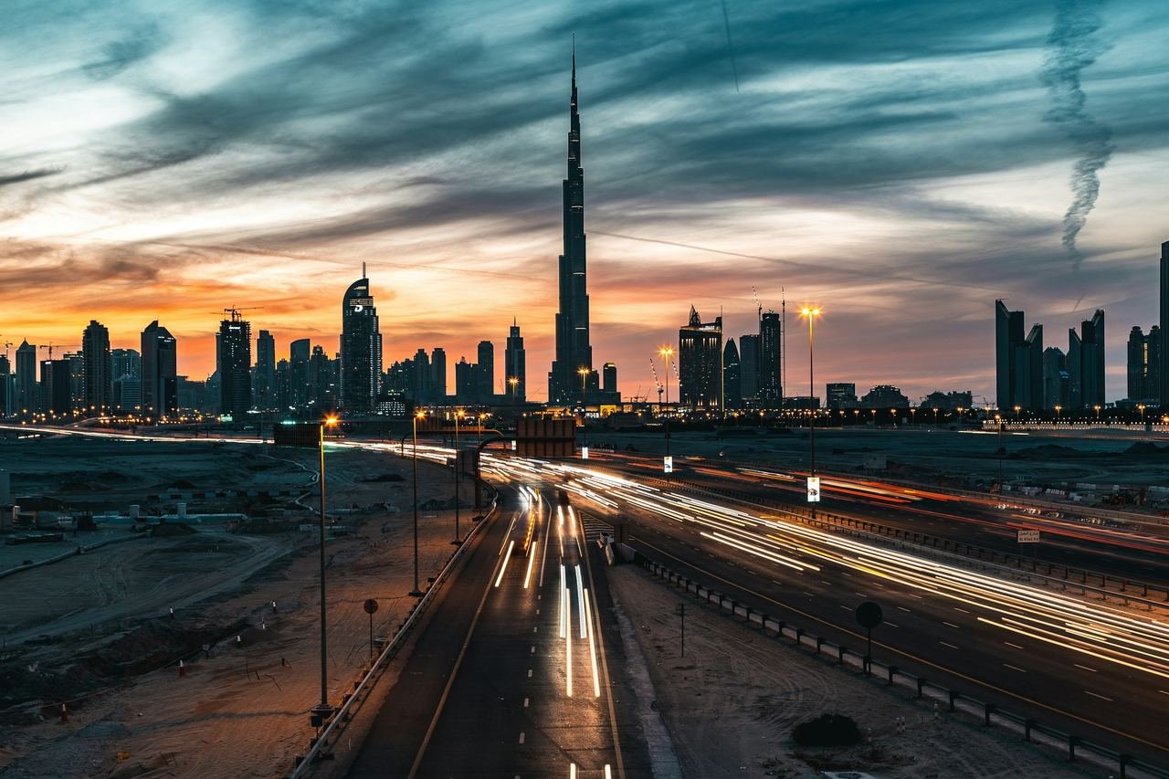 Evening traffic on the highway into Dubai with the Burj Khalifa on the skyline