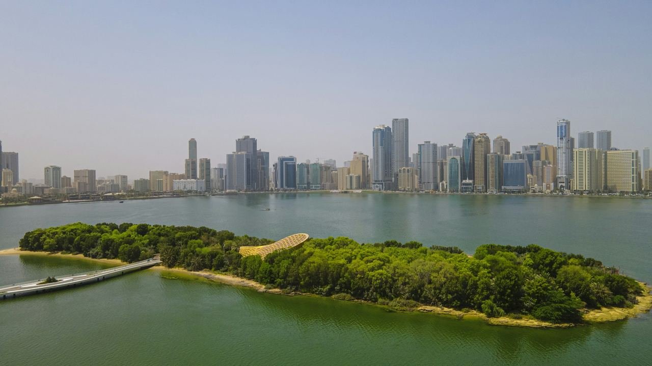 Sharjah skyline and Al Noor Island across the lagoon